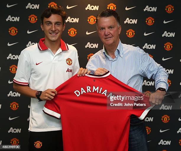 Matteo Darmian of Manchester United poses with Manager Louis van Gaal after signing for the club at Aon Training Complex on July 11, 2015 in...