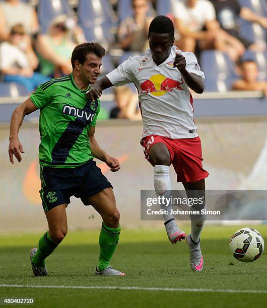 David Atanga of Salzburg and Cedric Soares of Southampton fight for the ball during the pre-season match for the 3rd place between FC Red Bull...