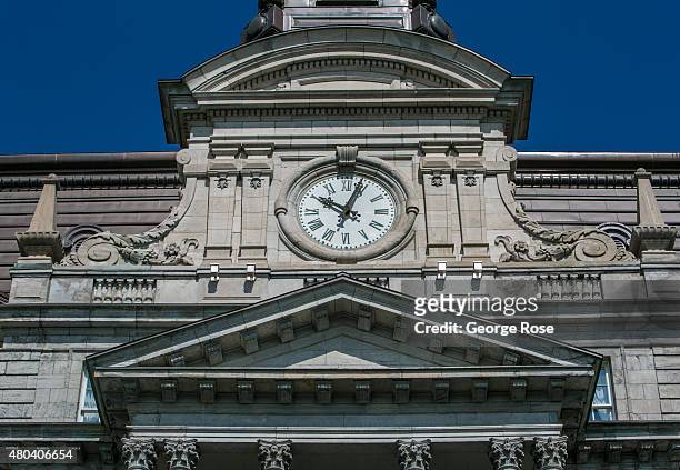 The clock tower at the Hotel de ville Montreal in Old Town is viewed on June 30, 2015 in Montreal, Quebec, Canada. Montreal, the largest city in...