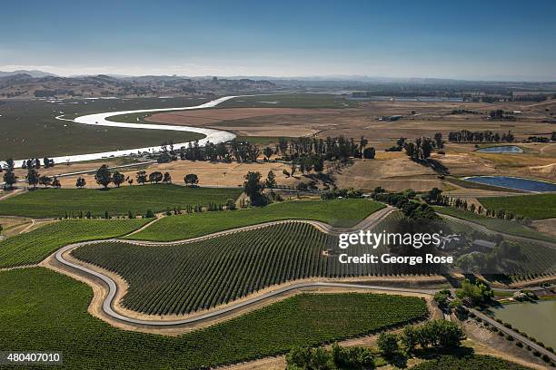 Prime farm and vineyard land sit at the edge of the San Francisco Bay as viewed from the air on June 22 near Petaluma, California. Growth has become...