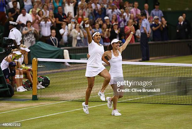 Sania Mirza of India and Martina Hingis of Switzerland celebrate after winning the Final Of The Ladies' Doubles against Ekaterina Makarova of Russia...