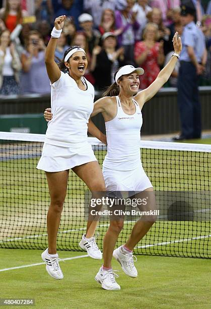 Sania Mirza of India and Martina Hingis of Switzerland celebrate after winning the Final Of The Ladies' Doubles against Ekaterina Makarova of Russia...