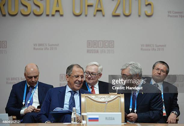 In this handout image supplied by Host Photo Agency / RIA Novosti, From left: Anton Siluanov, Minister of Finance of the Russian Federation; Sergei...