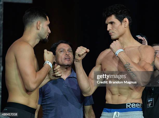 Jorge Masvidal and Cezar Ferreira face off during the TUF 21 Finale Weigh-in at the UFC Fan Expo in the Sands Expo and Convention Center on July 11,...