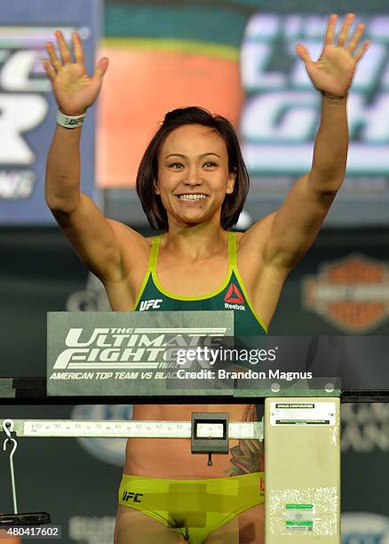 Michelle Waterson steps onto the scale during the TUF 21 Finale Weigh-in at the UFC Fan Expo in the Sands Expo and Convention Center on July 11, 2015...