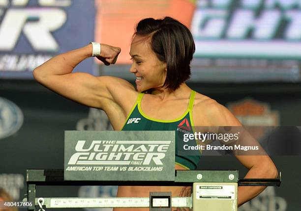 Michelle Waterson steps onto the scale during the TUF 21 Finale Weigh-in at the UFC Fan Expo in the Sands Expo and Convention Center on July 11, 2015...