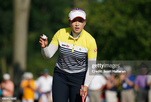 Amy Yang of South Korea waves to the gallery on the 17th green during the third round of the U.S. Women's Open at Lancaster Country Club on July 11,...