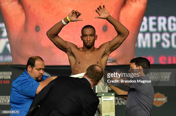 Dominic Water steps onto the scale during the TUF 21 Finale Weigh-in at the UFC Fan Expo in the Sands Expo and Convention Center on July 11, 2015 in...