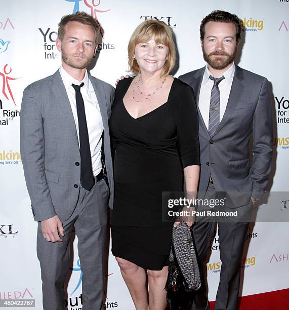 Actors Chris Masterson and Danny Masterson with their mother Carol Masterson arriving at the Youth For Human Rights International Celebrity Benefit...