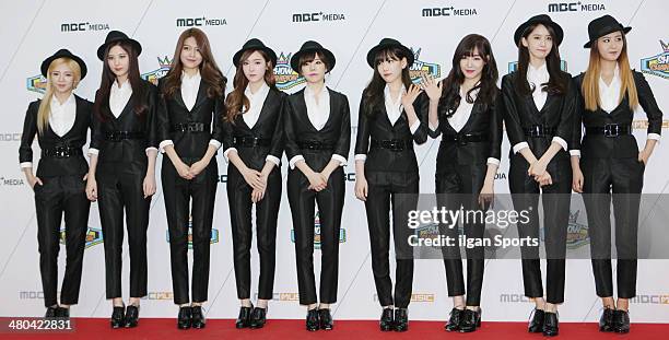 Girls' Generation pose for photographs during the MBC Music 'Show Champion' 100th anniversary event at Bitmaru on March 19, 2014 in Goyang, South...