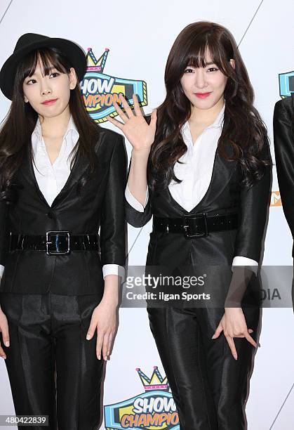 Girls' Generation pose for photographs during the MBC Music 'Show Champion' 100th anniversary event at Bitmaru on March 19, 2014 in Goyang, South...