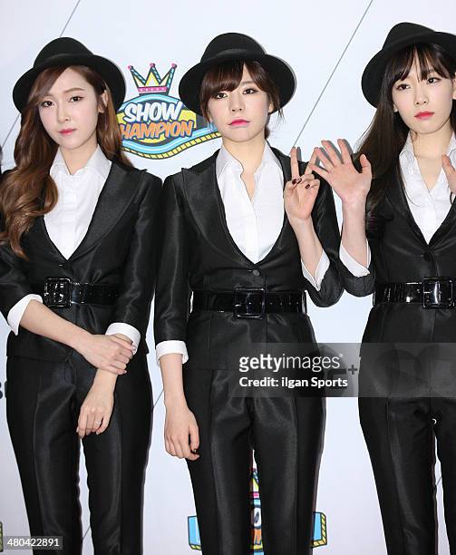 Girls' Generation pose for photographs during the MBC Music 'Show Champion' 100th anniversary event at Bitmaru on March 19, 2014 in Goyang, South...