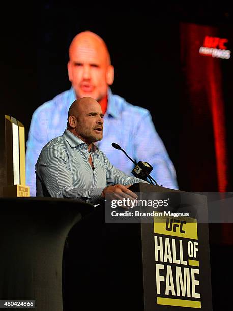 Bas Rutten gives his acceptance speech as he is inducted into the UFC Hall of Fame at the UFC Fan Expo in the Sands Expo and Convention Center on...