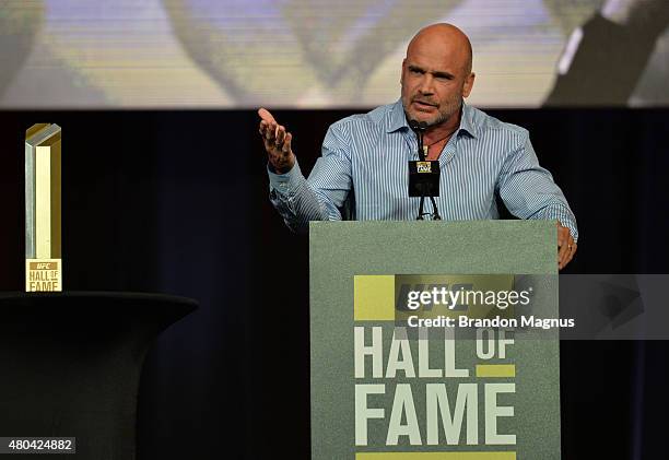 Bas Rutten gives his acceptance speech as he is inducted into the UFC Hall of Fame at the UFC Fan Expo in the Sands Expo and Convention Center on...