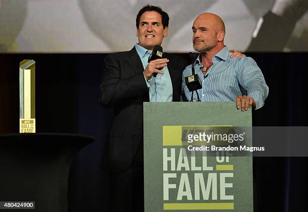 Mark Cuban shares moments with Bas Rutten as he is inducted into the UFC Hall of Fame at the UFC Fan Expo in the Sands Expo and Convention Center on...