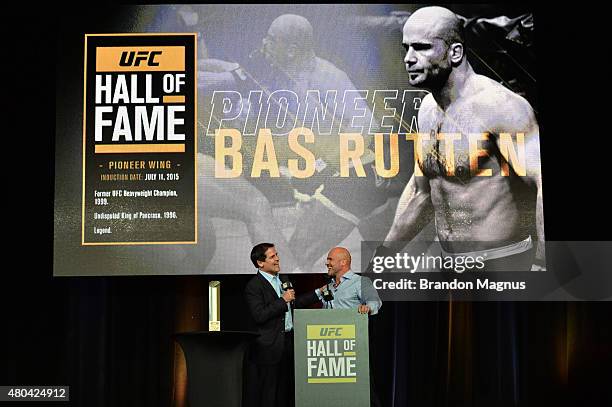 Mark Cuban shares moments with Bas Rutten as he is inducted into the UFC Hall of Fame at the UFC Fan Expo in the Sands Expo and Convention Center on...