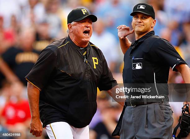 Manager Clint Hurdle of the Pittsburgh Pirates is ejected by home plate umpire Vic Carapazza in the second inning following a called foul bal that...