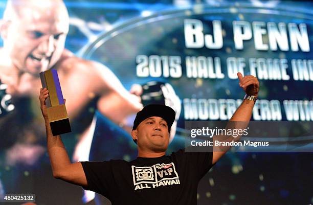 Penn receives his award as he is inducted into the UFC Hall of Fame at the UFC Fan Expo in the Sands Expo and Convention Center on July 11, 2015 in...