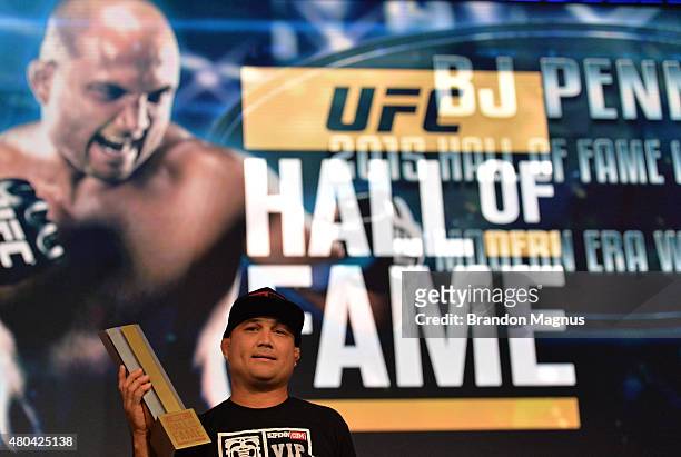 Penn receives his award as he is inducted into the UFC Hall of Fame at the UFC Fan Expo in the Sands Expo and Convention Center on July 11, 2015 in...