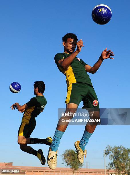 This photograph taken on March 17 shows Pakistani street children taking part in a football training camp in Karachi for the forthcoming Street Child...