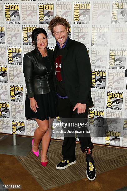 Gina Carano and T.J. Miller attend the 20'th Century Fox Press Line at Comic-Con International 2015 Day 3 on July 11, 2015 in San Diego, California.