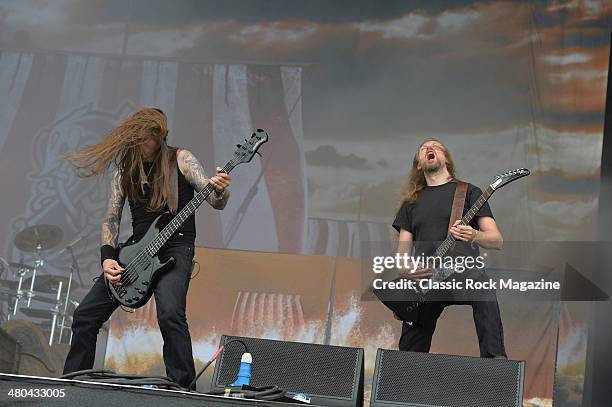 Guitarist Johan Soderberg and bassist Ted Lundstrom of Swedish death metal group Amon Amarth performing live on the Zippo Encore Stage at Download...