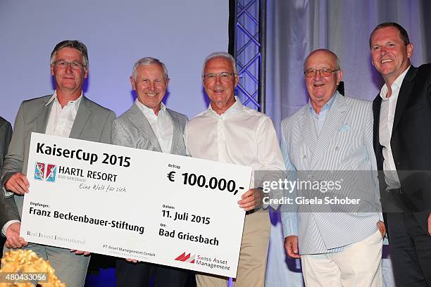 Martin Eininger, Hans-Dieter Cleven, Franz Beckenbauer, Alois Hartl, with cheque during the Kaiser Cup 2015 golfcup and gala on July 11, 2015 in Bad...