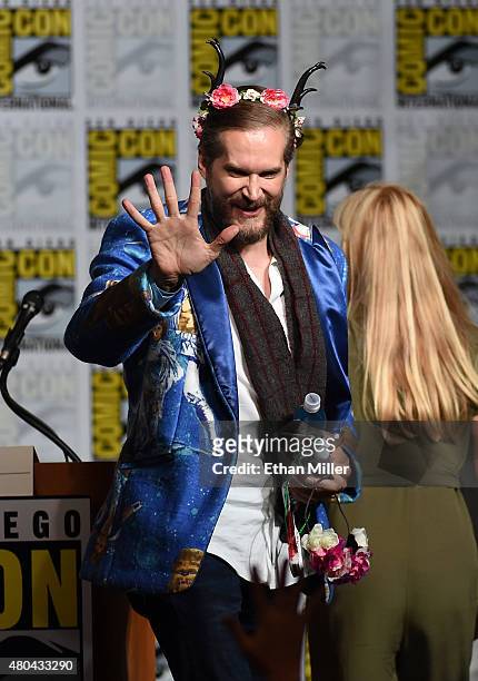 Executive producer/creator Bryan Fuller waves to fans at the "Hannibal" Savor the Hunt panel during Comic-Con International 2015 at the San Diego...
