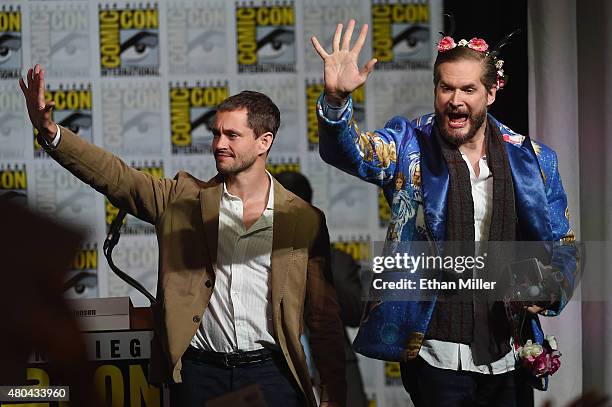 Actor Hugh Dancy and executive producer/creator Bryan Fuller wave to fans at the "Hannibal" Savor the Hunt panel during Comic-Con International 2015...