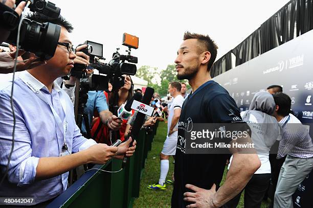 Hidetoshi Nakata is interviewed during the Laureus All Stars Unity Cup ahead of the 2014 Laureus World Sports Awards at Royal Selangor Club on March...
