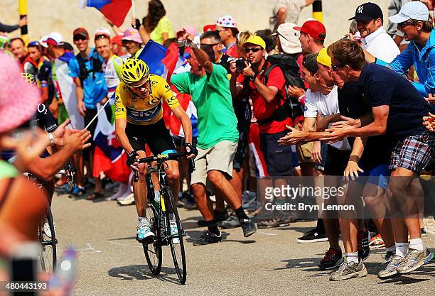 Fans cheers as current race leader and wearer of the Maillot Jaune, Chris Froome of Great Britain and SKY Procycling attacks to win the stage during...
