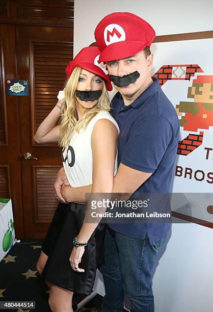 Actors Katie Cassidy and John Barrowman attend The Nintendo Lounge on the TV Guide Magazine yacht during Comic-Con International 2015 on July 11,...