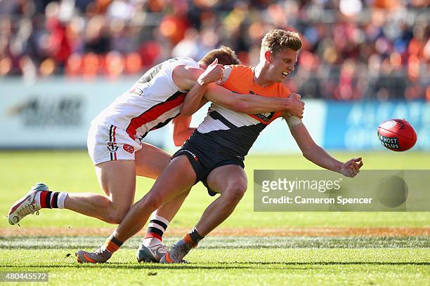 Lachie Whitfield of the Giants is tackled during the round 15 AFL match between the Greater Western Sydney Giants and the St Kilda Saints at Spotless...