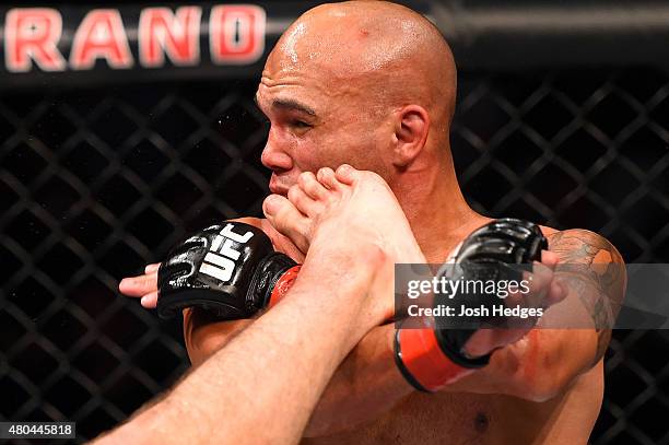 Rory MacDonald kicks Robbie Lawler in their UFC welterweight title fight during the UFC 189 event inside MGM Grand Garden Arena on July 11, 2015 in...