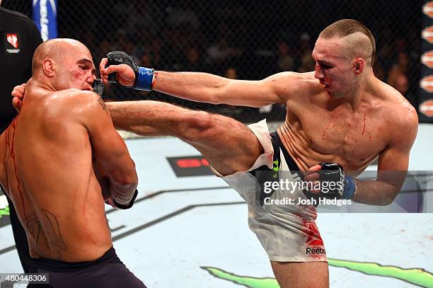 Rory MacDonald kicks Robbie Lawler in their UFC welterweight title fight during the UFC 189 event inside MGM Grand Garden Arena on July 11, 2015 in...