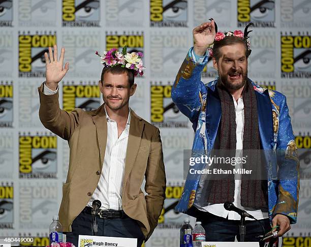 Actor Hugh Dancy and executive producer/creator Bryan Fuller wave to fans at the "Hannibal" Savor the Hunt panel during Comic-Con International 2015...