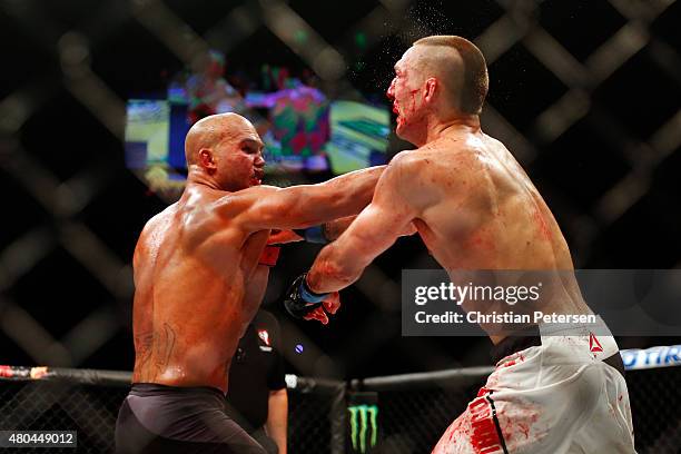 Robbie Lawler punches Rory MacDonald in their UFC welterweight title fight during the UFC 189 event inside MGM Grand Garden Arena on July 11, 2015 in...