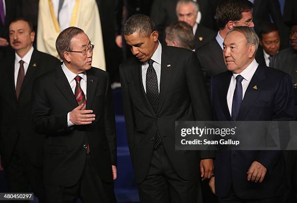President Barack Obama chats with U.N. Secretary General Ban Ki-moon and Kazakhstan President Nursultan Nazarbayev following the group photo at the...