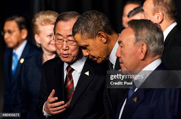 President Barack Obama chats with U.N. Secretary General Ban Ki-moon and Kazakhstan President Nursultan Nazarbayev following the group photo at the...