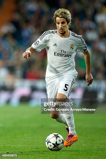 Fabio Coentrao of Real Madrid CF controls the ball during the UEFA Champions League Round of 16 second leg match at Estadio Santiago Bernabeu on...