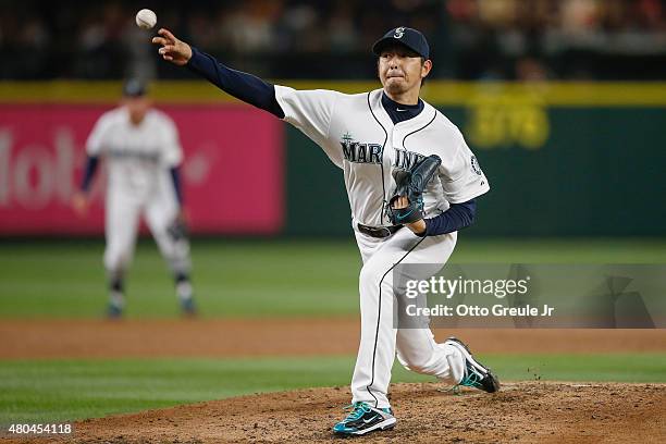 Starting pitcher Hisashi Iwakuma of the Seattle Mariners pitches against the Los Angeles Angels of Anaheim in the third inning at Safeco Field on...