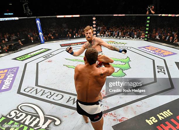 Conor McGregor kicks Chad Mendes in their UFC interim featherweight title fight during the UFC 189 event inside MGM Grand Garden Arena on July 11,...