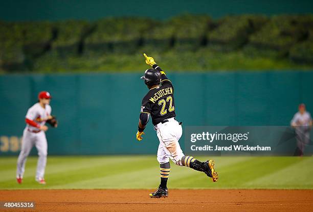 Andrew McCutchen of the Pittsburgh Pirates reacts after hitting the game-winning two run home run in the 14th inning against the St Louis Cardinals...