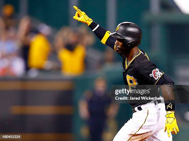 Andrew McCutchen of the Pittsburgh Pirates reacts after hitting the game-winning two run home run in the 14th inning against the St Louis Cardinals...