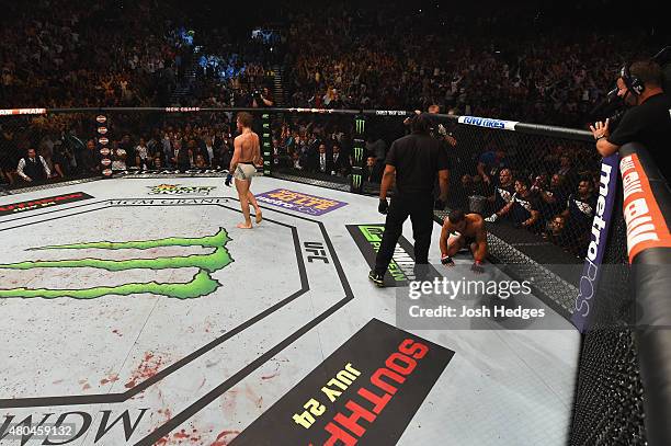 Conor McGregor reacts to his victory over Chad Mendes in their UFC interim featherweight title fight during the UFC 189 event inside MGM Grand Garden...