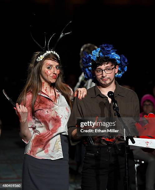 Rotem Rusak of New York and Cassandra Solis of Texas ask the panel a question at the "Hannibal" Savor the Hunt panel during Comic-Con International...