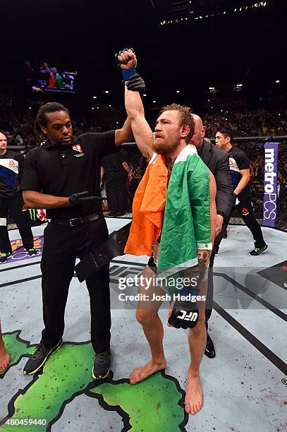 Chad Mendes reacts to his victory over Chad Mendes in their UFC interim featherweight title fight during the UFC 189 event inside MGM Grand Garden...