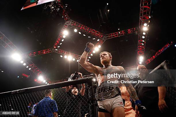 Conor McGregor reacts to his victory over Chad Mendes in their UFC interim featherweight title fight during the UFC 189 event inside MGM Grand Garden...