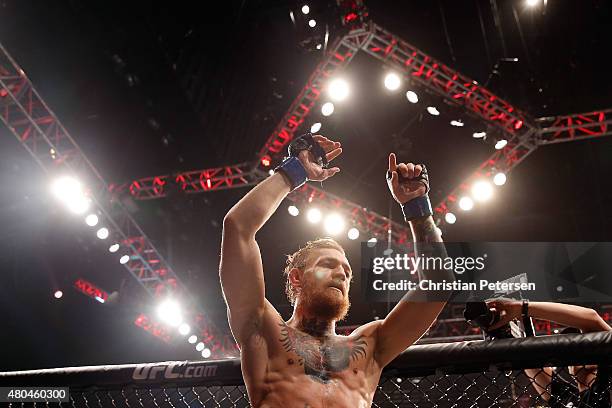 Conor McGregor reacts to his victory over Chad Mendes in their UFC interim featherweight title fight during the UFC 189 event inside MGM Grand Garden...