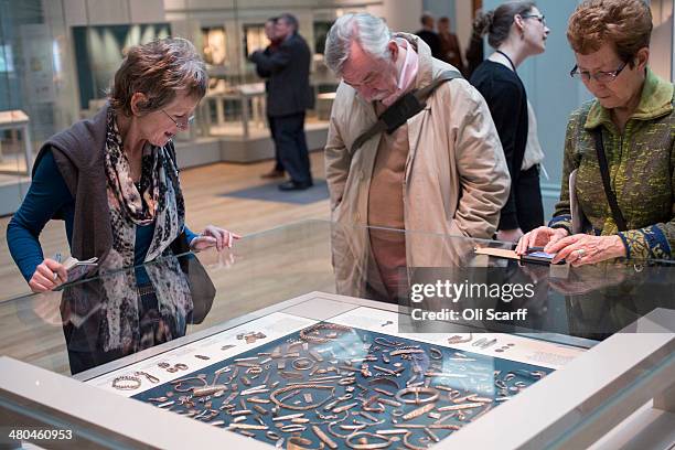 People view historic artifacts on display from the 'Cuerdale Hoard' in the new gallery 'Sutton Hoo and Europe AD 300-1100' in the British Museum on...